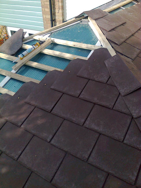 A Chesnut Brown Tapco slate roof on its way to be completed by us